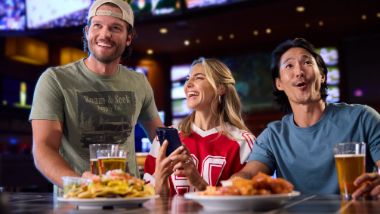 People cheering at the table